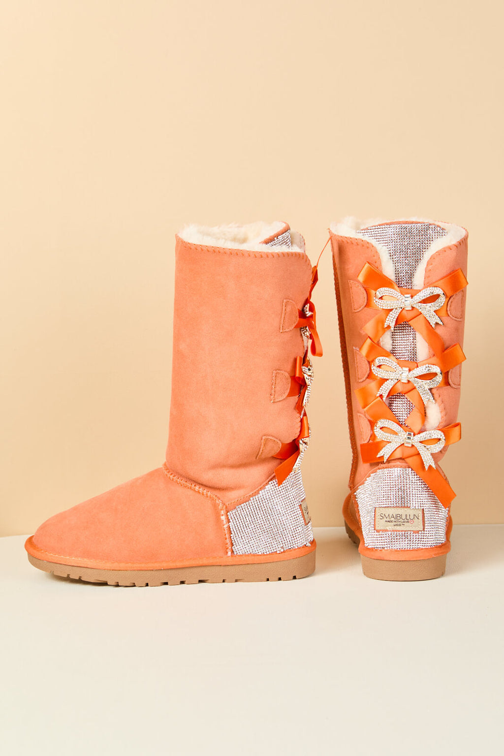 UGG Rhinestone Ribbon Tri-Tie Bow Suede Boots - Tangerine